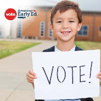 young boy with vote sign
