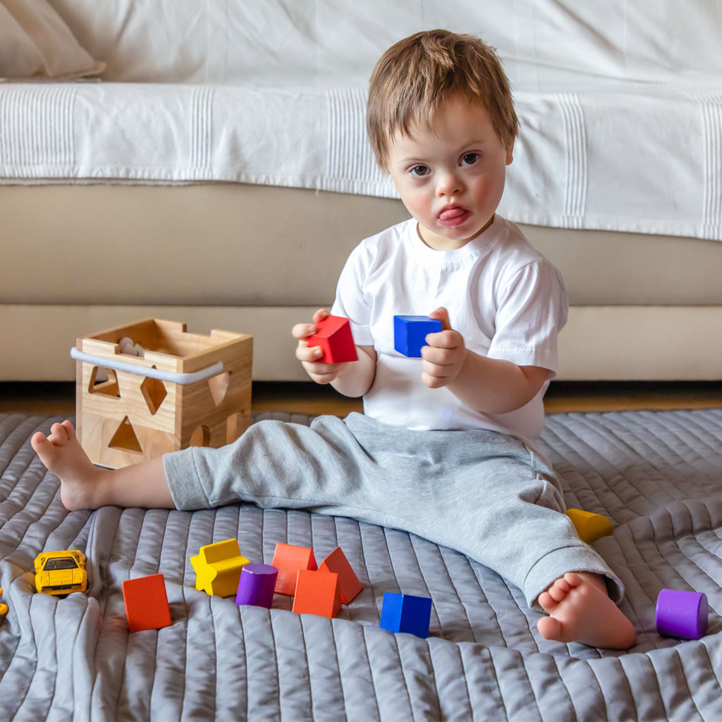 young boy playing with blocks